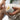 Person holding a jar of CBD balm, applying balm his knees.