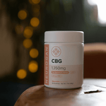 CBG Gummies 1350mg bottle on a wooden table