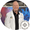 Dr. James Chuchard, a Professor of Family Medicine, smiling in a lab coat against a colorful background.