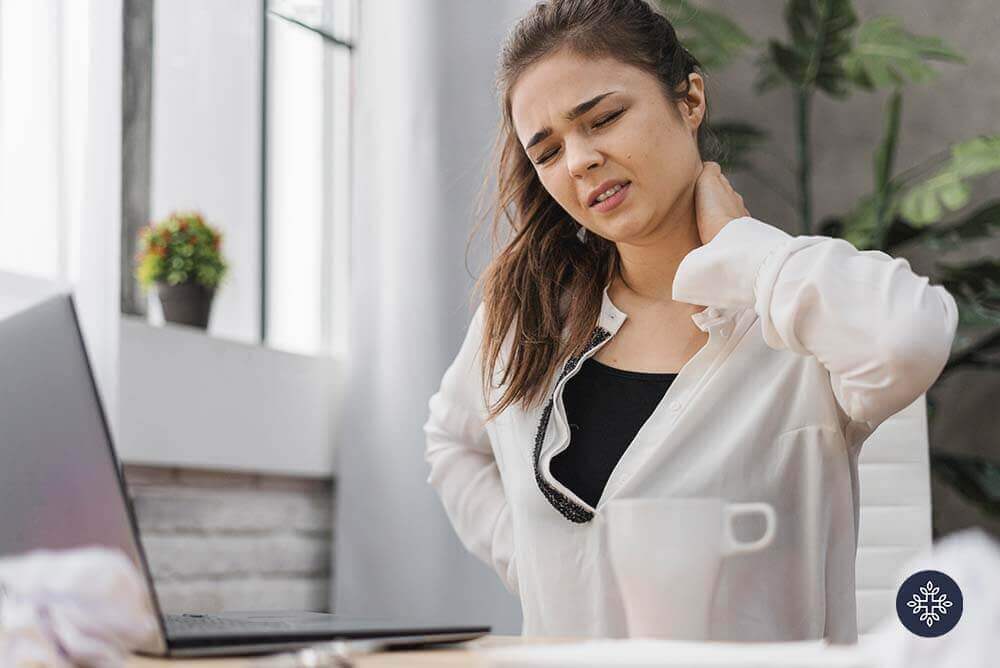Woman holding her nape because of discomfort from pain