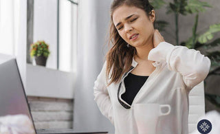 Woman holding her nape because of discomfort from pain