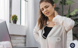 Woman holding her nape because of discomfort from pain