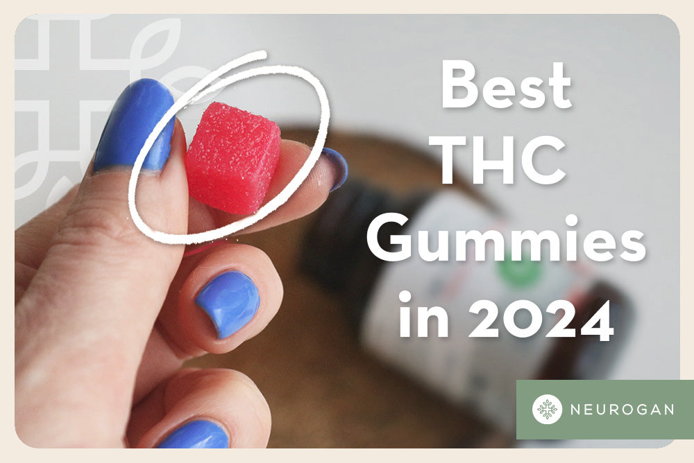 Close up of a woman holding a piece of red THC Gummy
