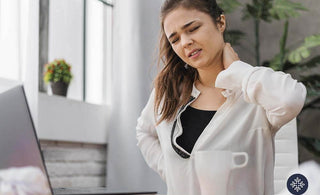 Woman holding her nape because of discomfort from pain