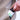 hand grabbing a bottle of extra strength cbd softgels from jacket