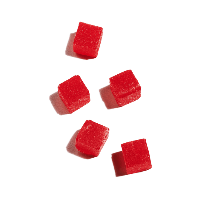 five shiny and berry-colored CBD gummies