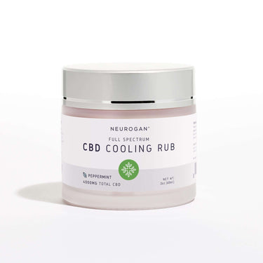Neurogan Full Spectrum CBD Cooling Rub in a glass jar with beige colored cream and silver lid