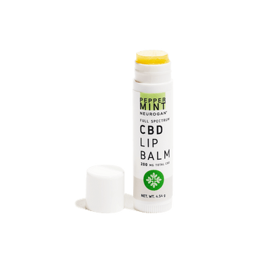 Uncapped CBD Lip balm peppermint showing yellow tip of the balm