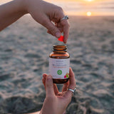 person getting a piece of CBD Gummy Squares on a beach