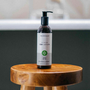 CBD Lotion on a wooden stool