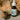 bottle of Neurogan Full Spectrum CBD Pet Oil 1000MG beside an orange cat's paw